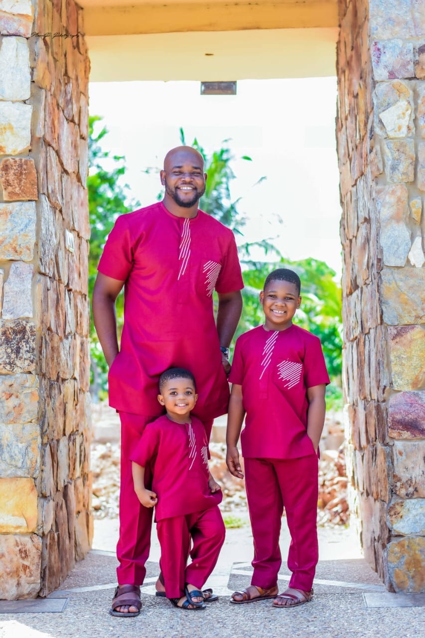 A father and two sons in matching wine sets