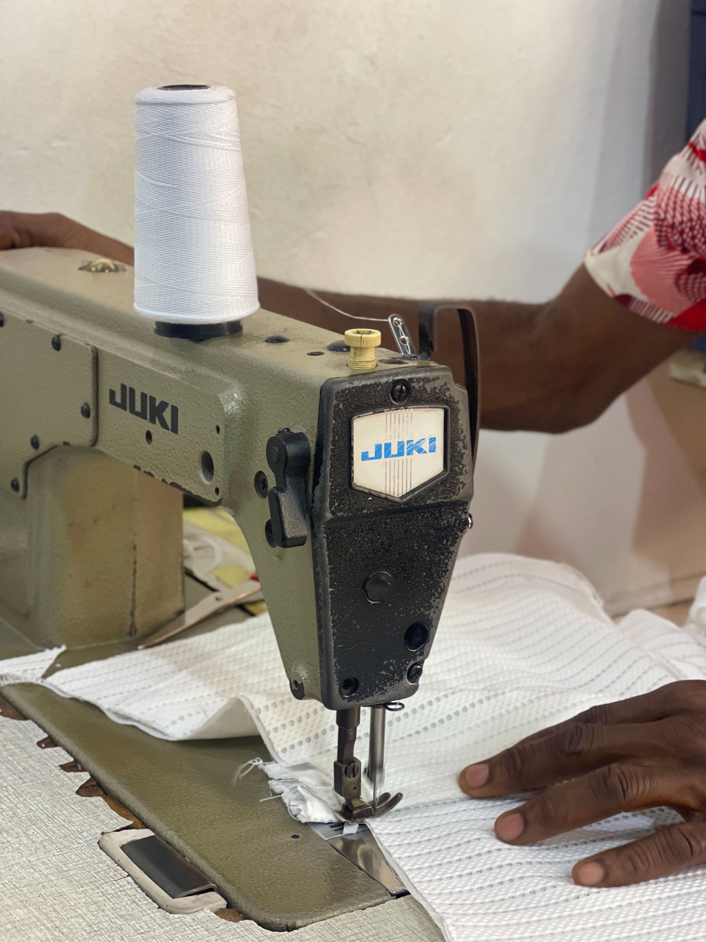 At the sewing machine