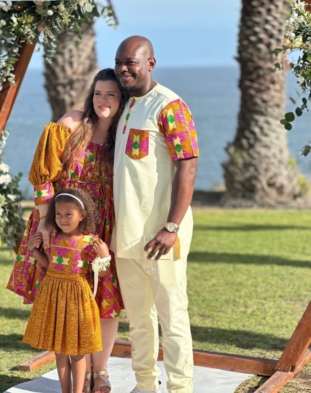A family dressed for a wedding by the sea